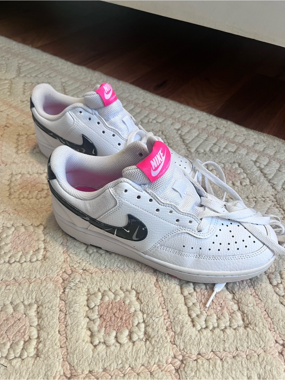 Nike Women's White Low-Top Sneakers with Black Swoosh and Pink Tongue